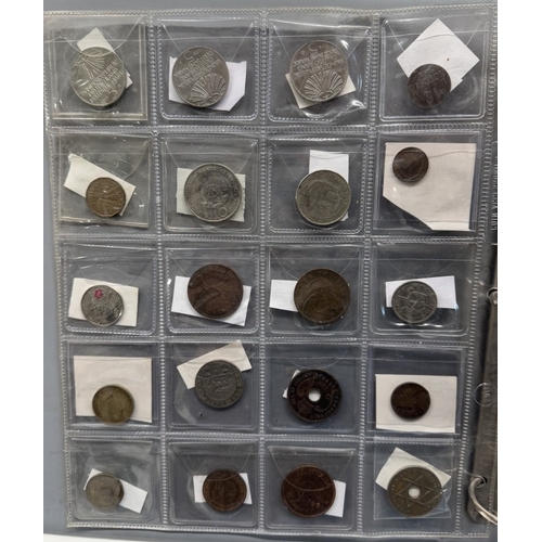 1126 - An album of world coins