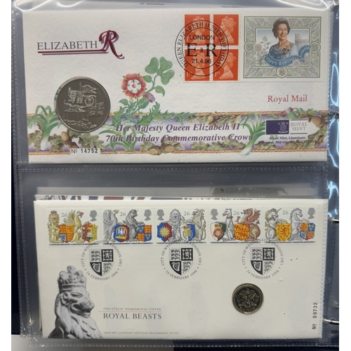 1127 - A collection of 20 Royal Mail stamp & coin covers including Royal Mail/Royal Mint album