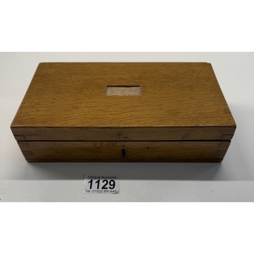 1129 - An oak cased maths set