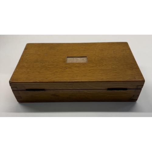 1129 - An oak cased maths set