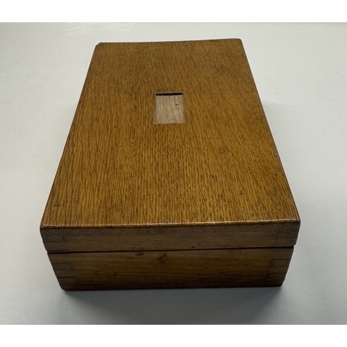 1129 - An oak cased maths set