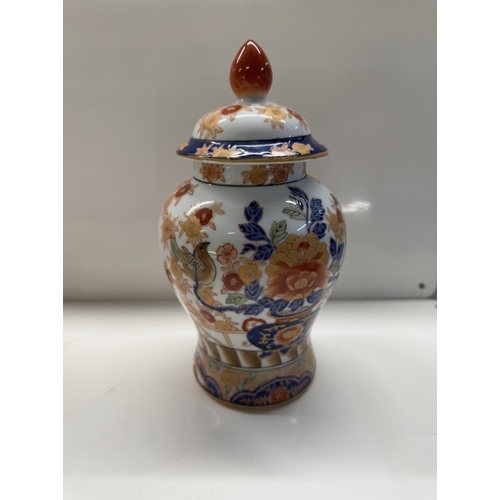 1138 - A Chinese pottery trio of 2 urns & centre vase