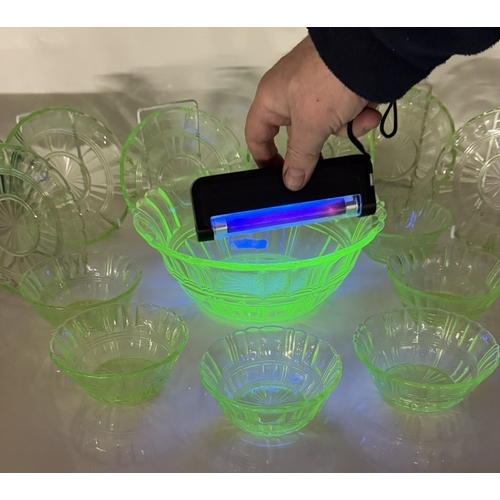 1141 - A vintage set of uranium glass fruit bowl with 6 matching dishes & 6 saucers