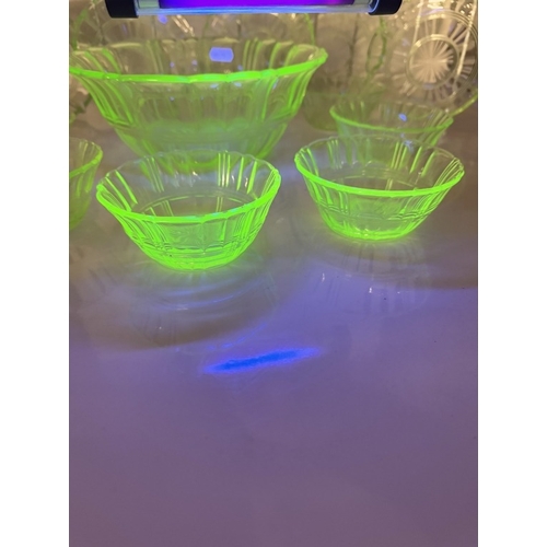 1141 - A vintage set of uranium glass fruit bowl with 6 matching dishes & 6 saucers