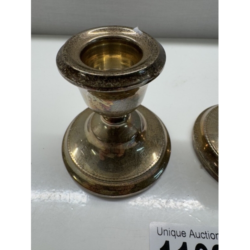 1109 - A pair of short sterling silver filled candlesticks. Height 6.5cm