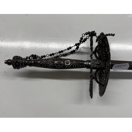 1146 - A steel court sword with beaded hilt & facetted studded decoration.