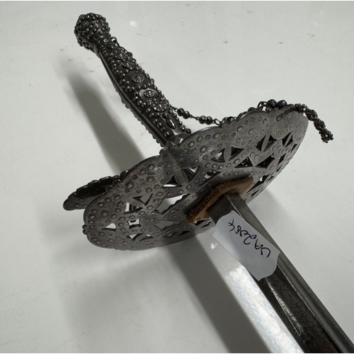 1146 - A steel court sword with beaded hilt & facetted studded decoration.