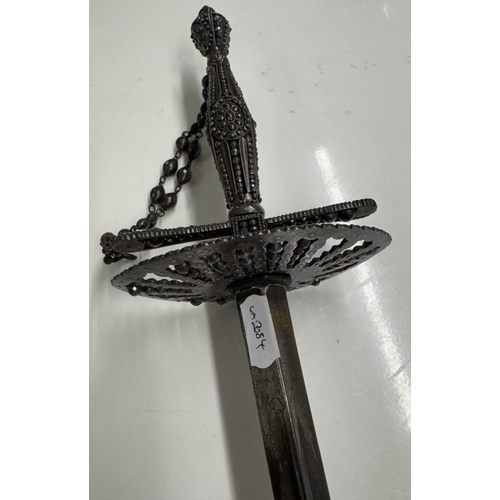 1148 - A steel court sword with beaded hilt, facetted studded decoration & scabbard.