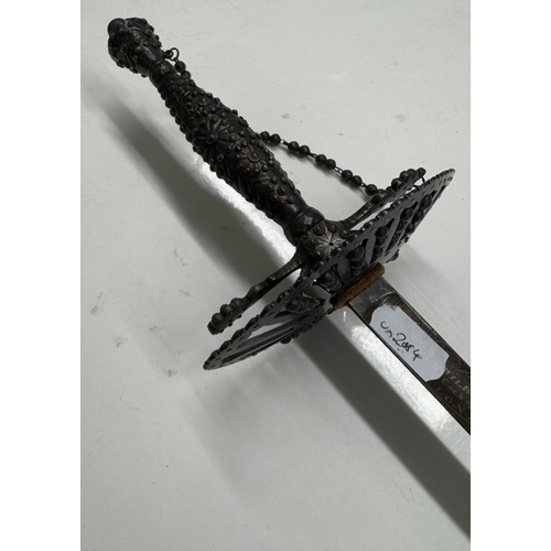 1149 - A steel court sword with beaded hilt & facetted studded decoration.