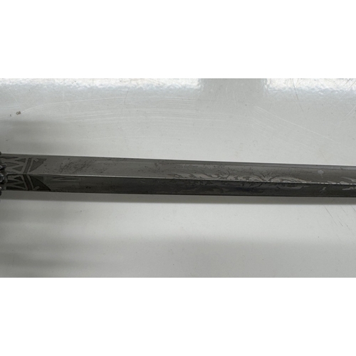 1150 - A steel court sword with beaded hilt, facetted studded decoration & scabbard.