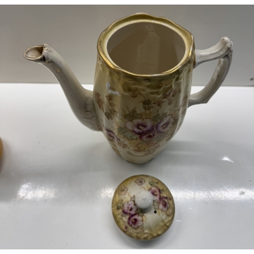 1151 - An early 20th century floral pattern coffee pot, sugar bowl & 1 other item