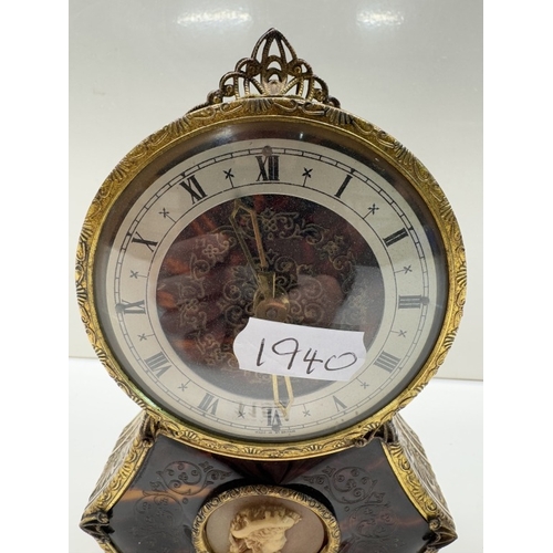 1152 - A small vintage mantle clock in an earlier style with a faux cameo panel. Rd no 872088. Height 14.5c... 