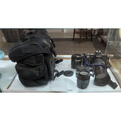 1391 - A Minolta camera with lenses & carry bag