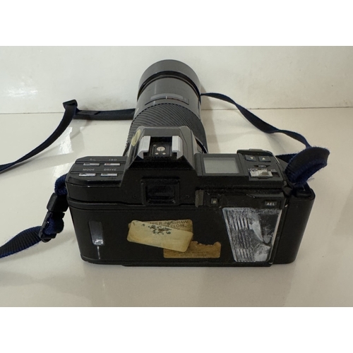 1391 - A Minolta camera with lenses & carry bag