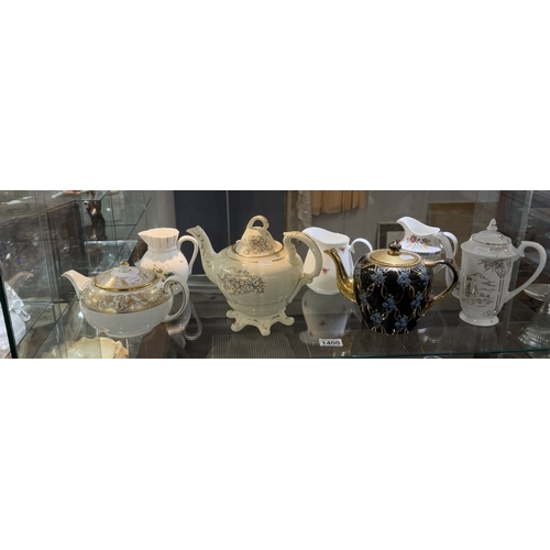 1400 - A collection of ceramic tea pots & jugs including Noritake, Royal Doulton etc