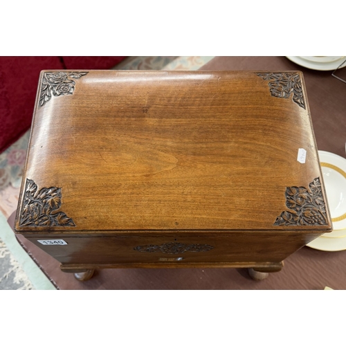 1340 - A hardwood box with carved decoration on Queen Anne legs