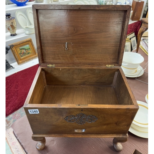 1340 - A hardwood box with carved decoration on Queen Anne legs