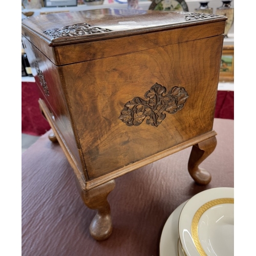 1340 - A hardwood box with carved decoration on Queen Anne legs