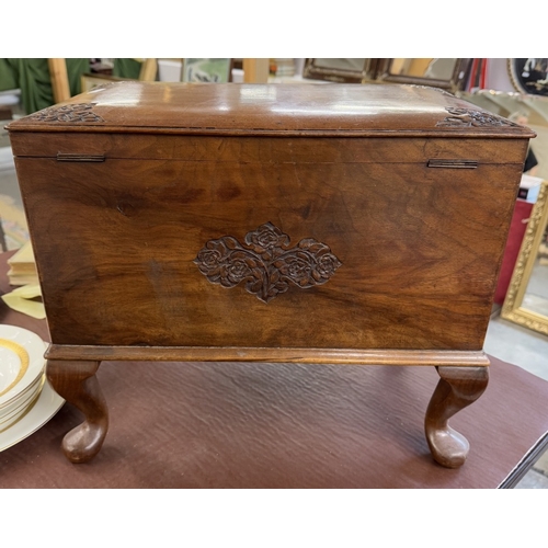 1340 - A hardwood box with carved decoration on Queen Anne legs