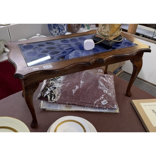 1343 - A hardwood coffee table with display cabinet top