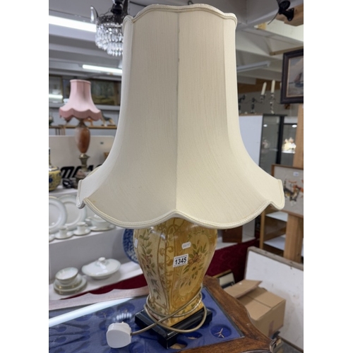 1345 - A pottery table lamp with shade.