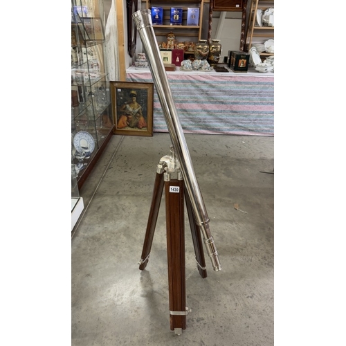 1430 - A large silver plated brass telescope on tripod stand. Length 98cm