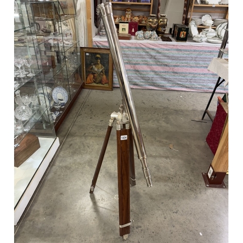 1434 - A large silver plated brass telescope on tripod stand. Length 98cm