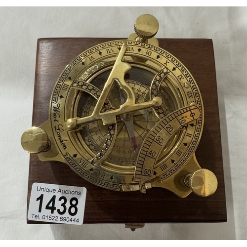 1438 - A brass multi sextant / sundial in brass bound teak box