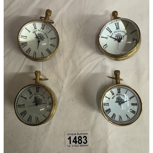 1483 - 4 Heavy brass & glass paperweight clocks with quartz movements.