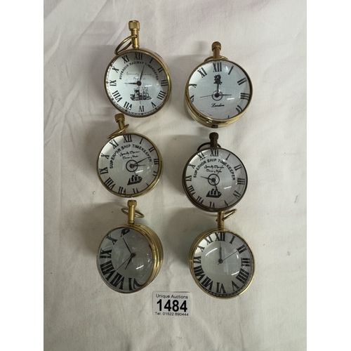 1484 - 6 Heavy brass & glass paperweight clocks with quartz movements.