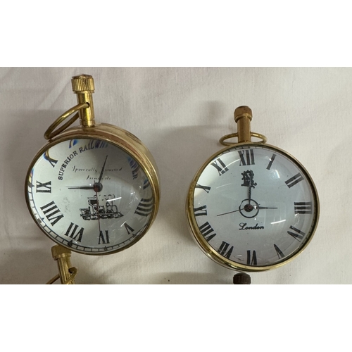 1484 - 6 Heavy brass & glass paperweight clocks with quartz movements.