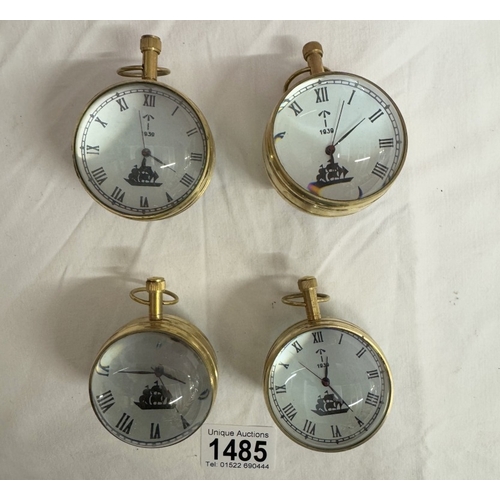 1485 - 4 Heavy brass & glass paperweight clocks with quartz movements.