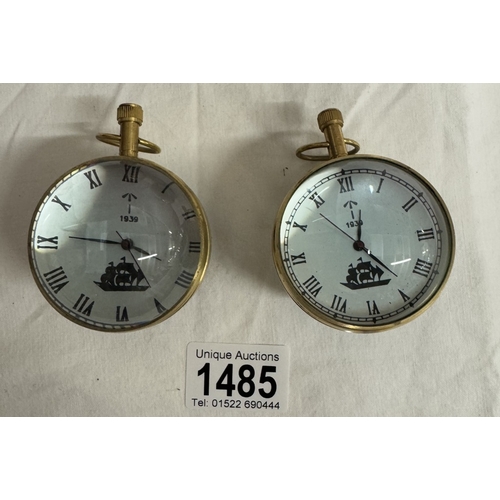 1485 - 4 Heavy brass & glass paperweight clocks with quartz movements.