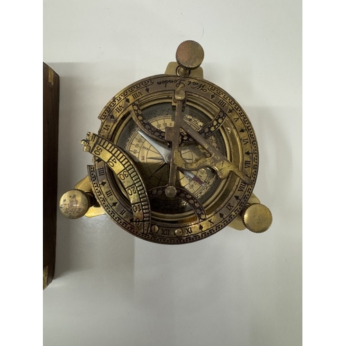 1498 - A brass multi sextant / sundial in brass bound teak box