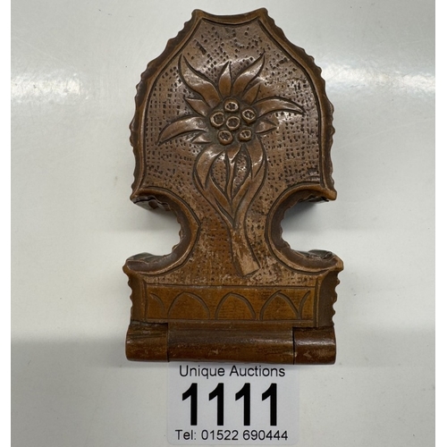 1111 - An antique carved wooden pocket watch holder