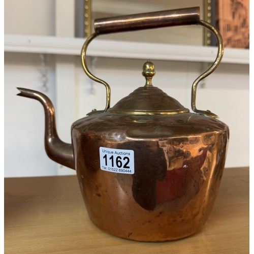 1162 - A Victorian copper kettle