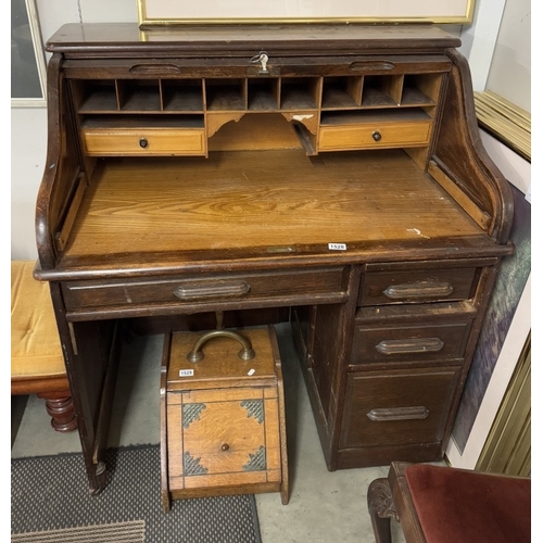 1528 - An Edwardian oak single pedestal roll top desk