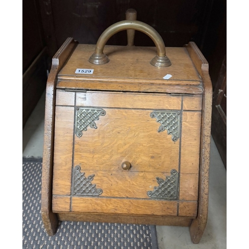 1529 - An Edwardian oak coal box with brass basket weave embellishments