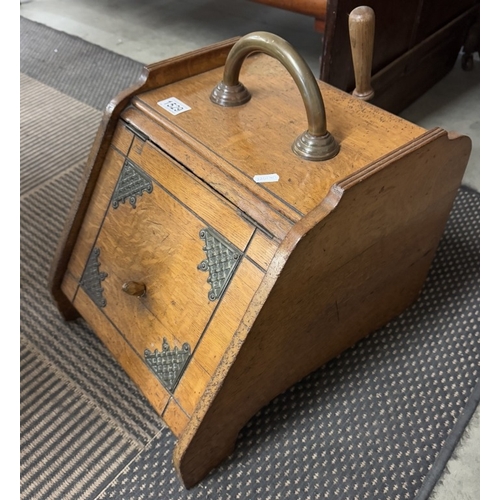 1529 - An Edwardian oak coal box with brass basket weave embellishments