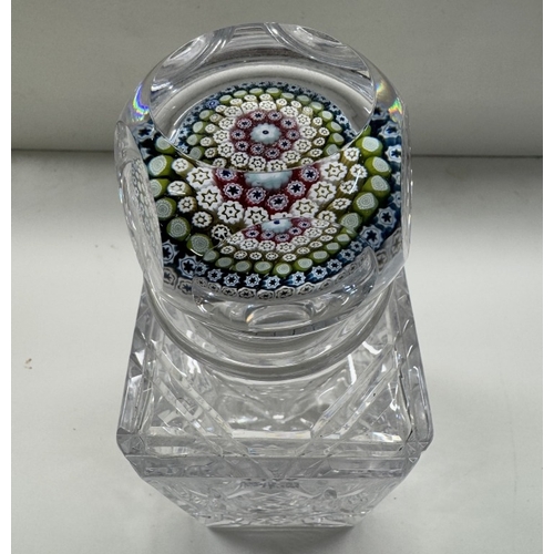 1169 - A cut glass Whitefriars decanter with Millefiori paperweight stopper dated 1977 in decoration