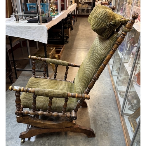 1176 - An American rocking chair with neck bolster