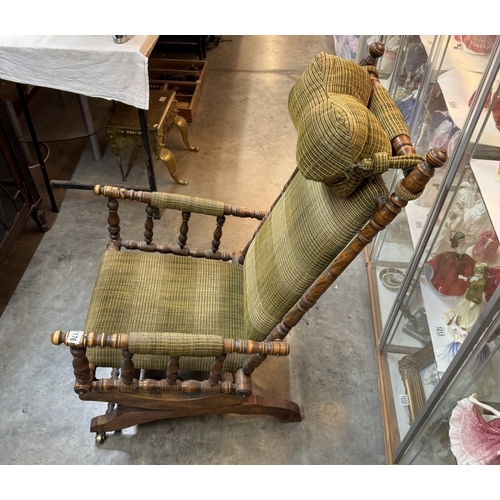 1176 - An American rocking chair with neck bolster