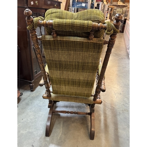 1176 - An American rocking chair with neck bolster