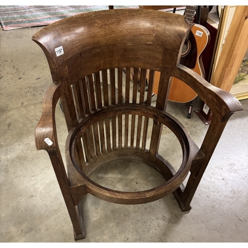 1197 - A Frank Lloyd Wright style barrel chair. Manufacturer flaw to back top right