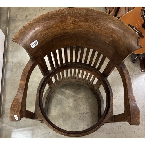 1197 - A Frank Lloyd Wright style barrel chair. Manufacturer flaw to back top right