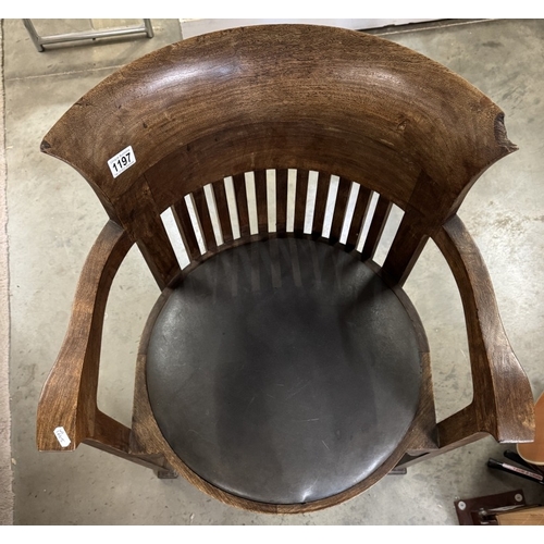 1197 - A Frank Lloyd Wright style barrel chair. Manufacturer flaw to back top right