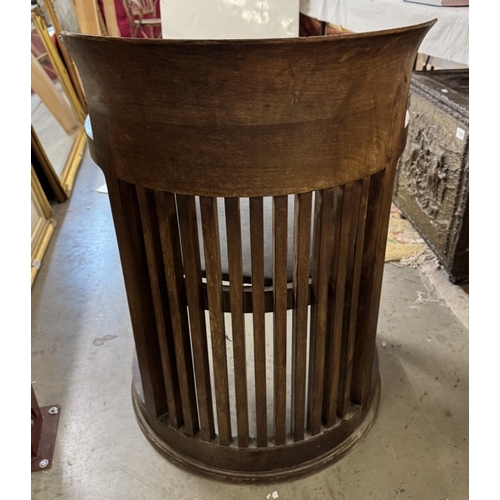 1197 - A Frank Lloyd Wright style barrel chair. Manufacturer flaw to back top right