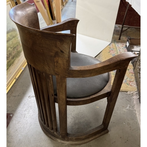 1197 - A Frank Lloyd Wright style barrel chair. Manufacturer flaw to back top right