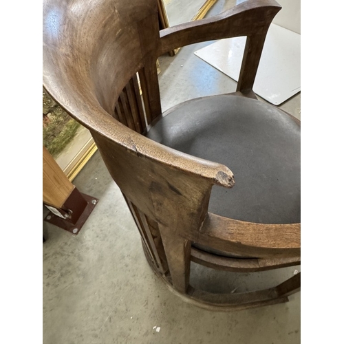 1197 - A Frank Lloyd Wright style barrel chair. Manufacturer flaw to back top right