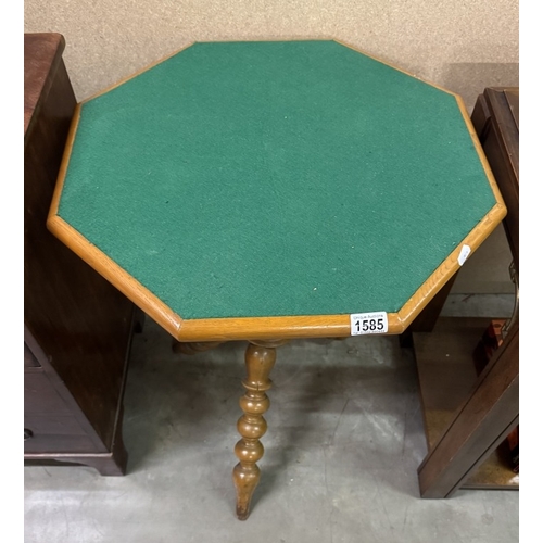 1585 - An octagonal games table on turned leg base